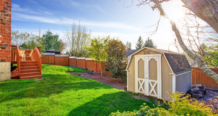 Fenced backyard with storage shed in Minneapolis